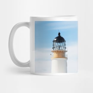 The Neist Lighthouse against a blue sky - Isle of Skye, Scotland Mug